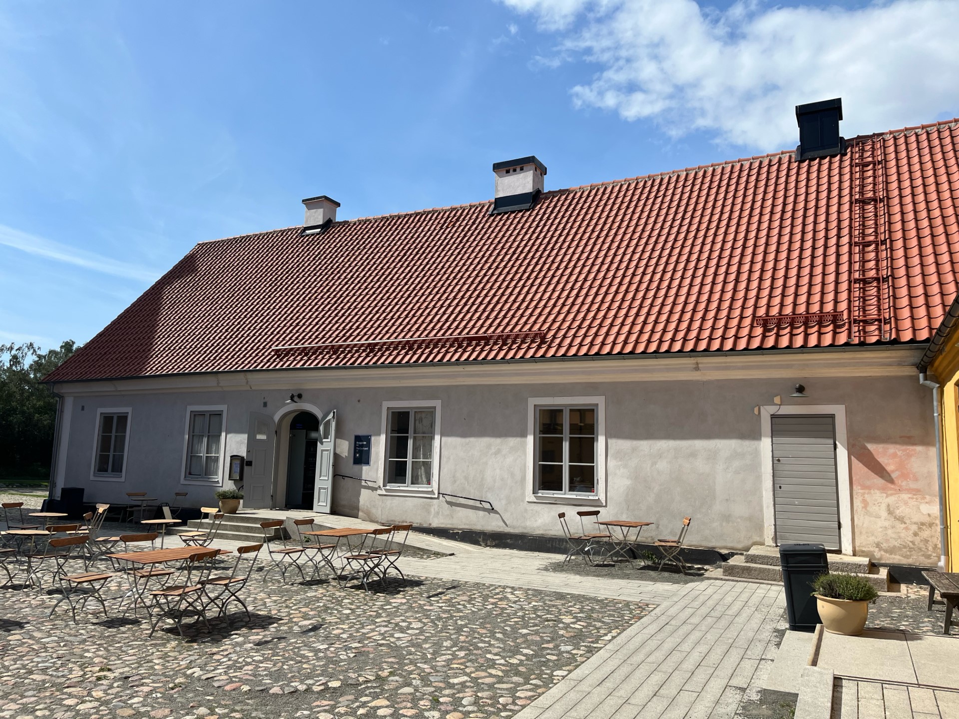 The image show's the café building in sunny weather.