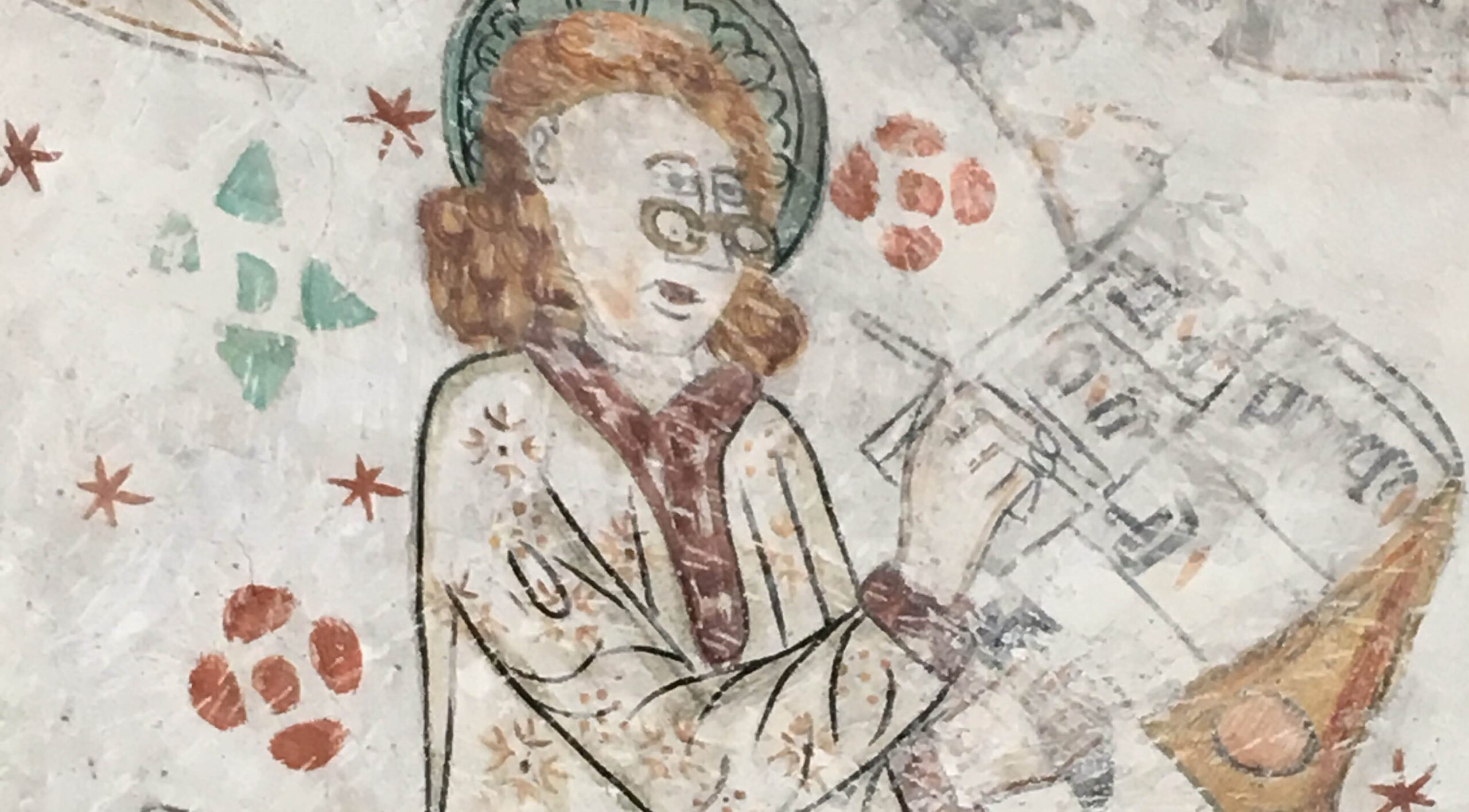 A medeival scribe at his pulpit wearing glasses.