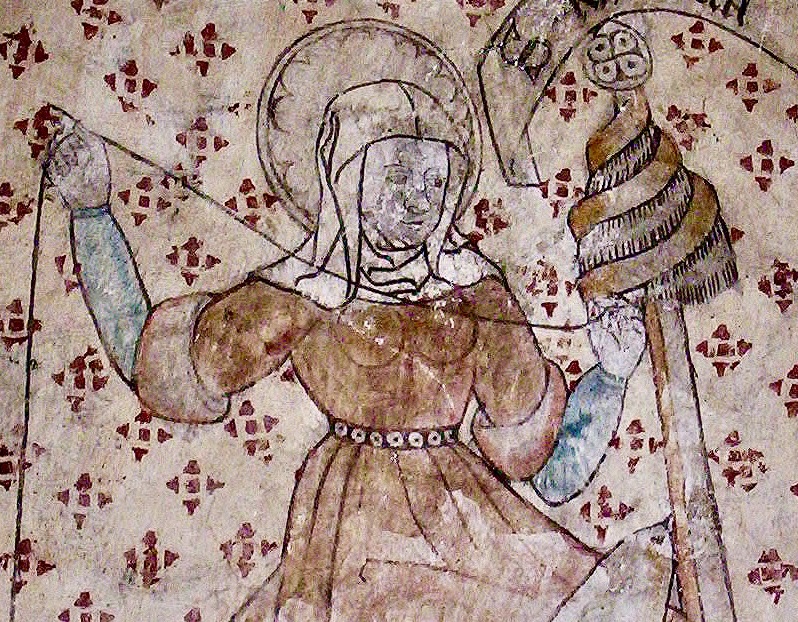 En medeltida kvinna spinner på slända.